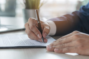 Contract Document Official. Close Up Person Signing His Signatur